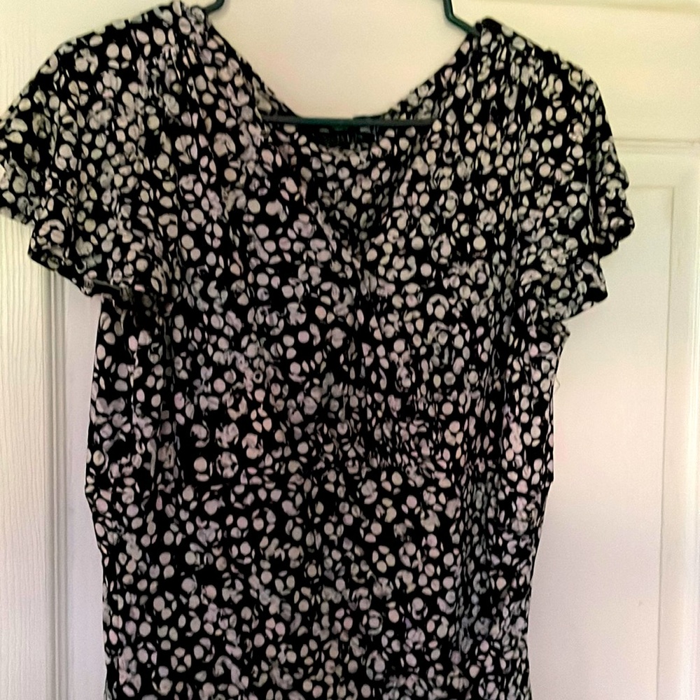 black and white dress draped under the knee